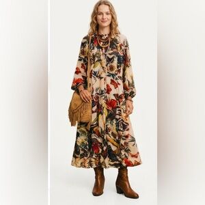 H&M dress featuring a flora and fauna pattern.
